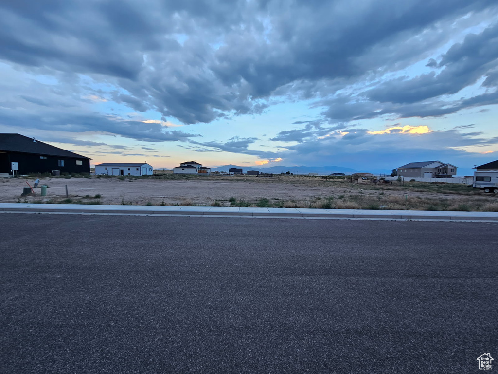 View of asphalt street with curbs