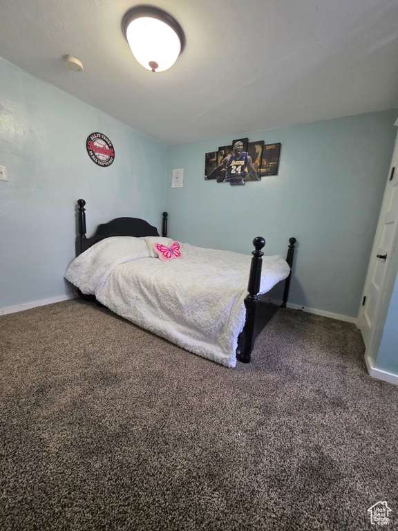 Carpeted bedroom with baseboards