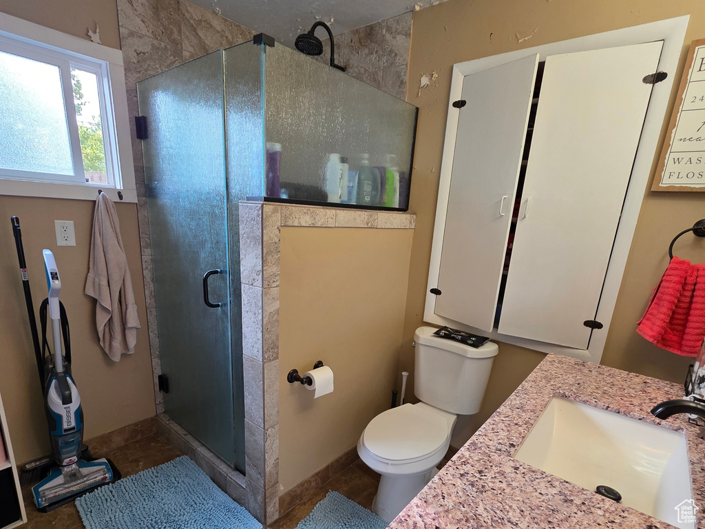 Full bath featuring vanity and a stall shower