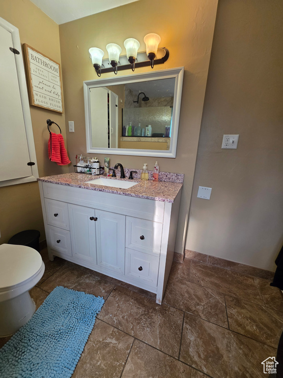 Bathroom with stone finish flooring and vanity
