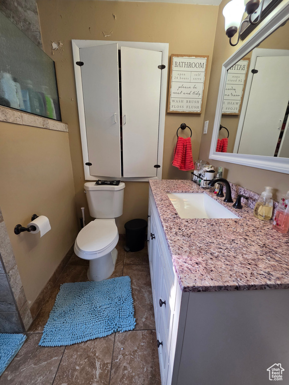 Bathroom with vanity and a chandelier