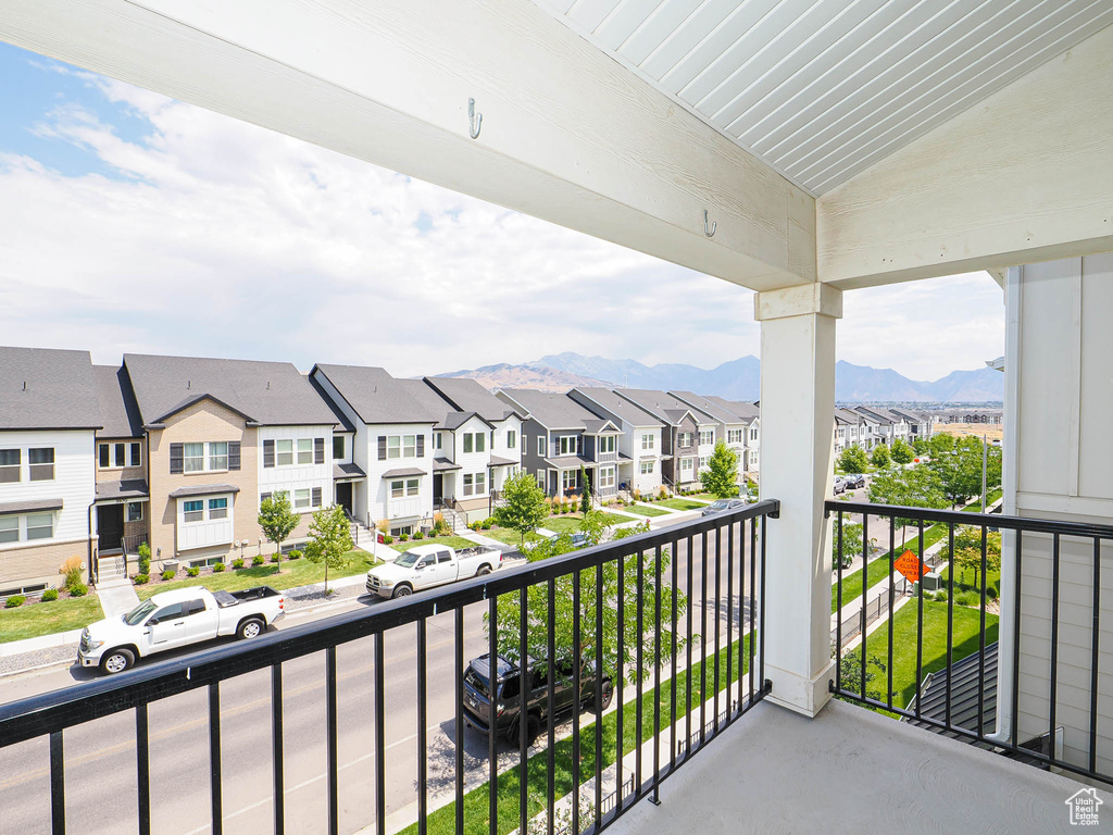 Balcony with a residential view and a mountain view