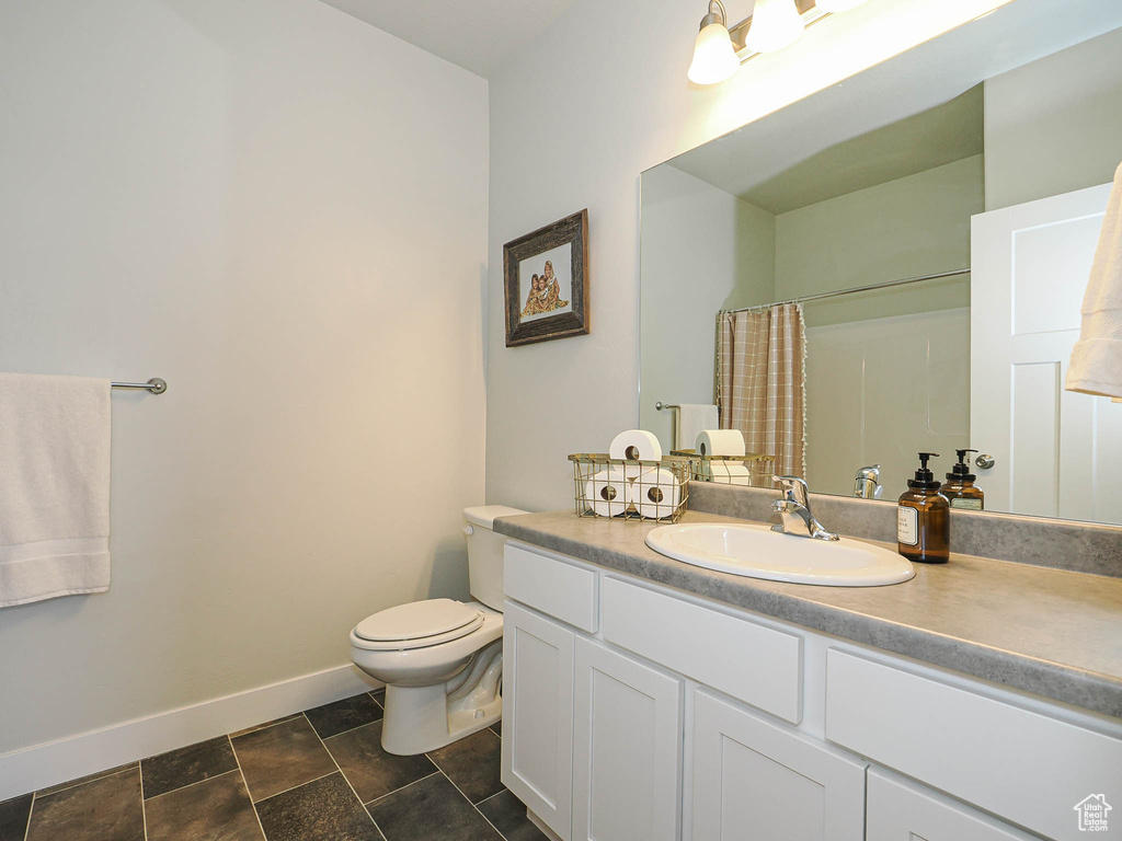 Bathroom with vanity and a shower with shower curtain