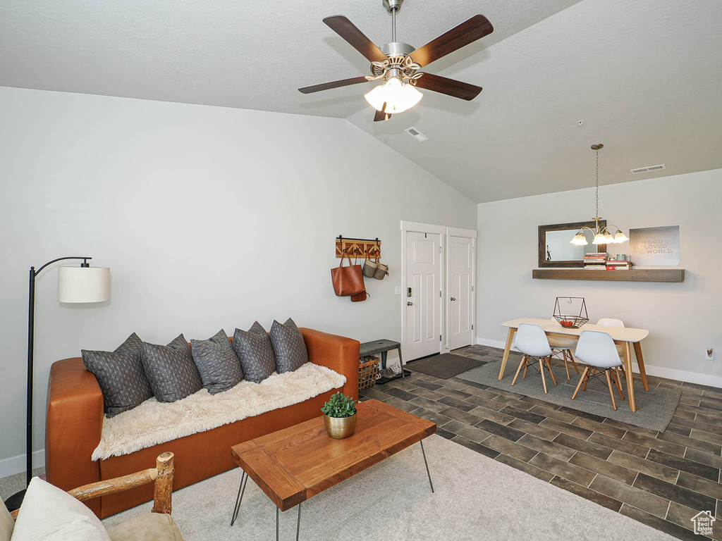 Living area featuring lofted ceiling and ceiling fan