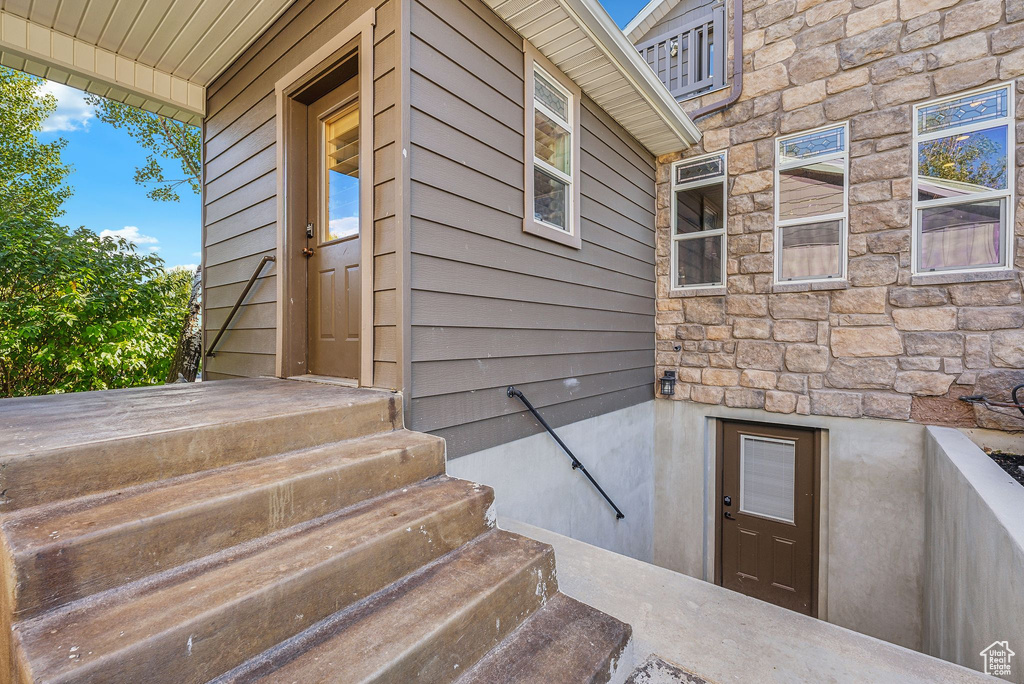 Property entrance with stone siding