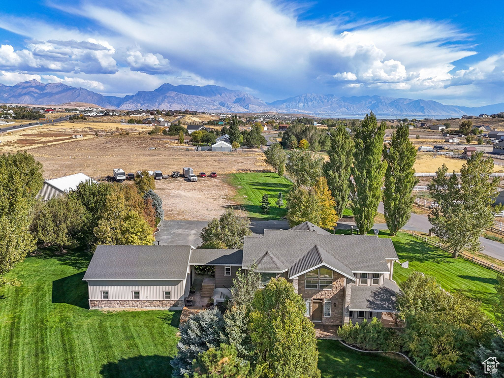 View from above of property with a mountain backdrop