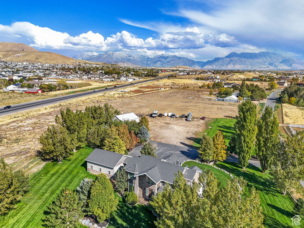Aerial overview of property's location featuring a mountain backdrop