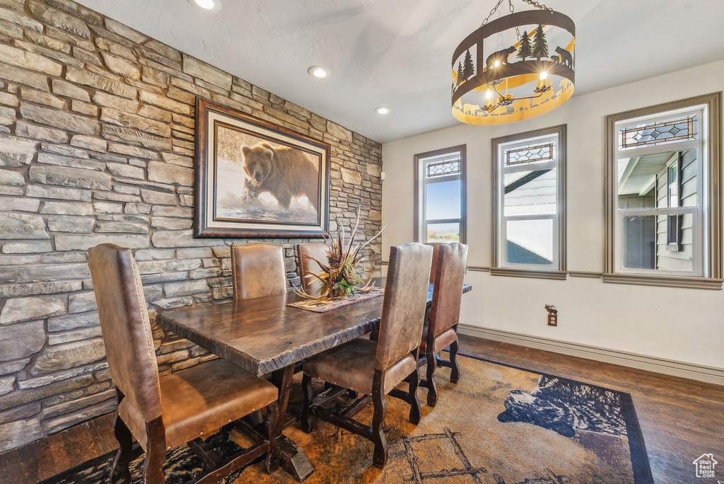 Dining area featuring wood finished floors, a chandelier, and recessed lighting