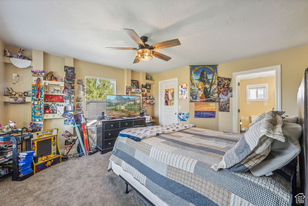Bedroom featuring carpet and ceiling fan