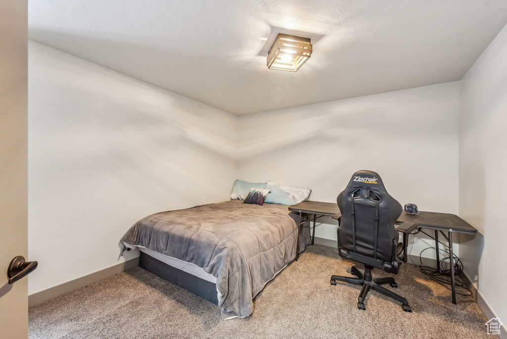 Carpeted bedroom with baseboards