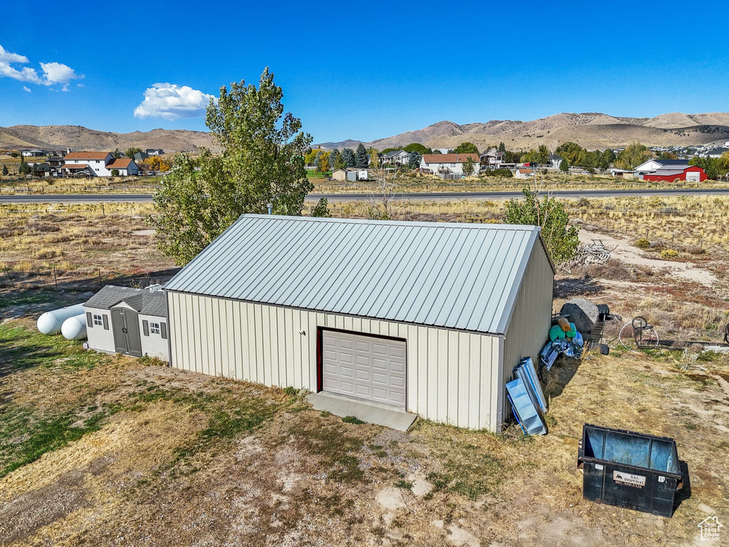 View of outbuilding featuring a mountain view