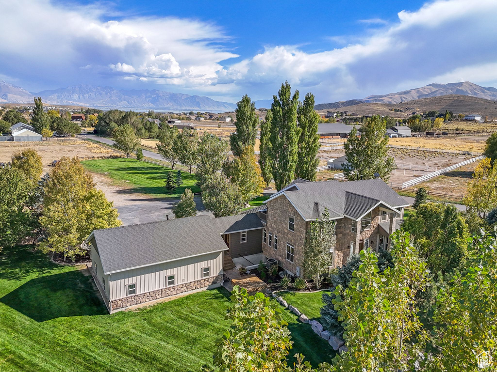 View from above of property with a mountain backdrop