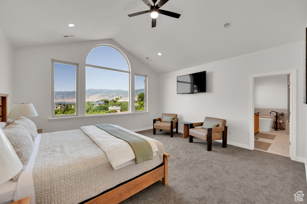 Bedroom with lofted ceiling, carpet, recessed lighting, ceiling fan, and ensuite bathroom