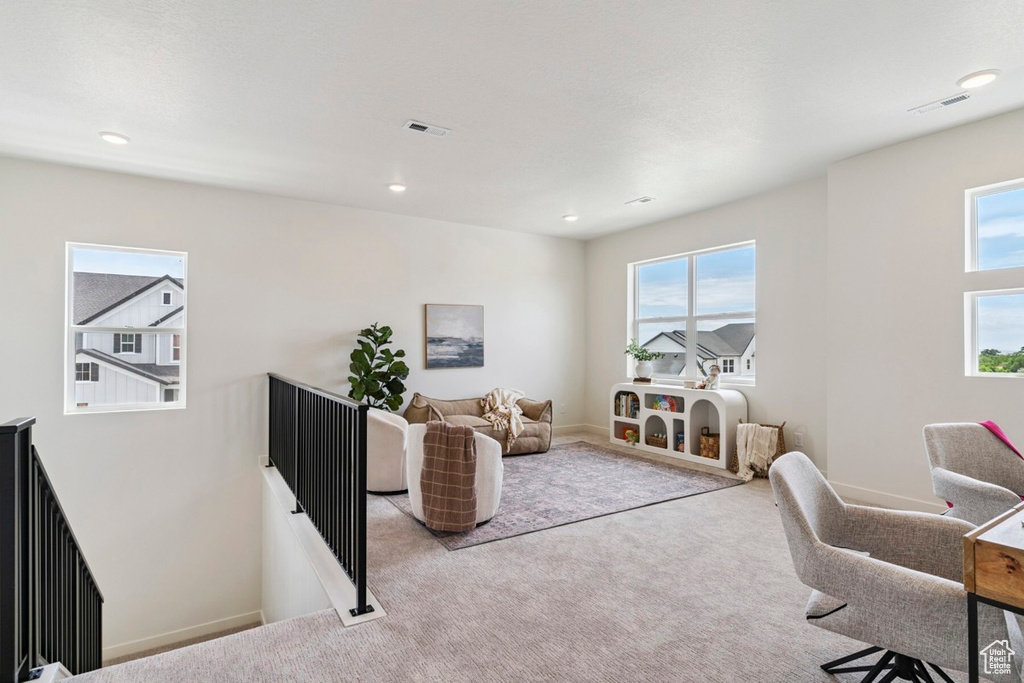 Home office with carpet flooring and recessed lighting