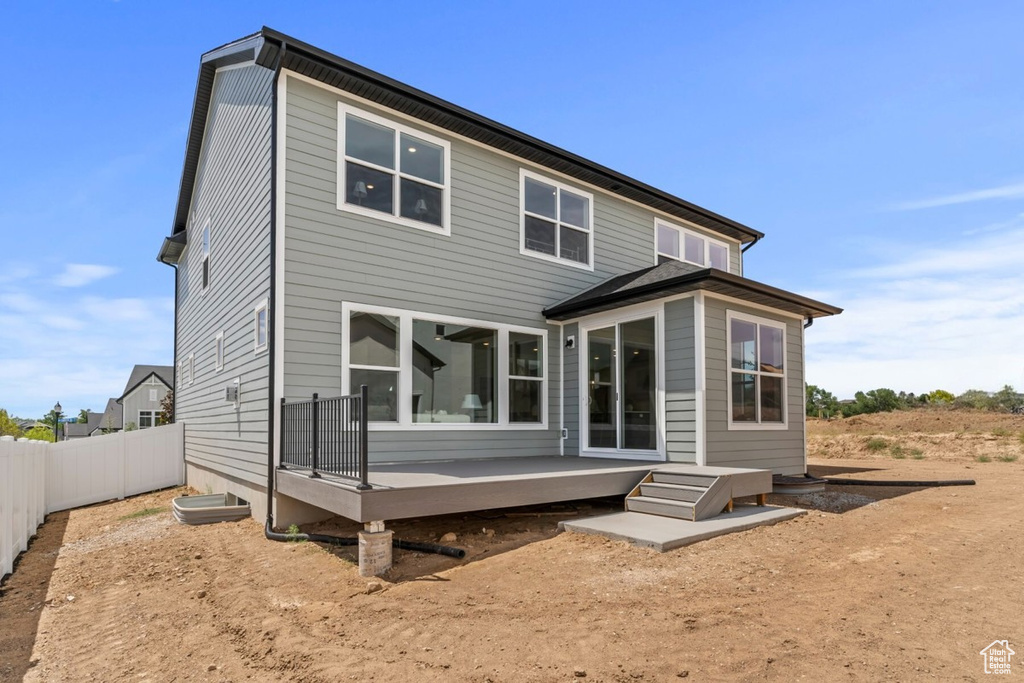 Rear view of property with a wooden deck