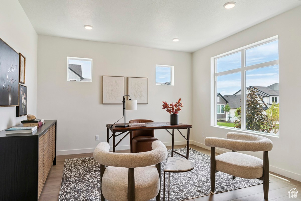 Home office featuring light wood-type flooring and recessed lighting