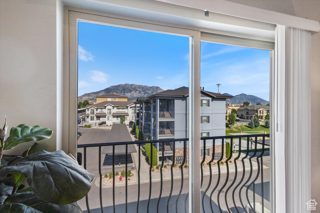 Balcony featuring a mountain view and a residential view