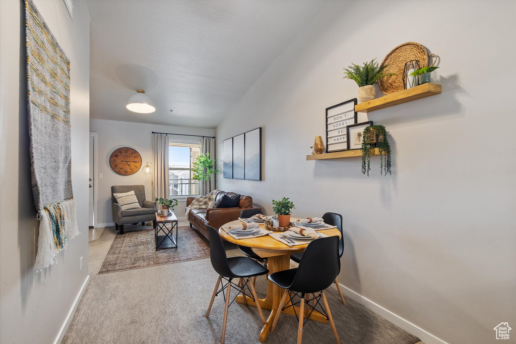 Dining area with carpet and baseboards