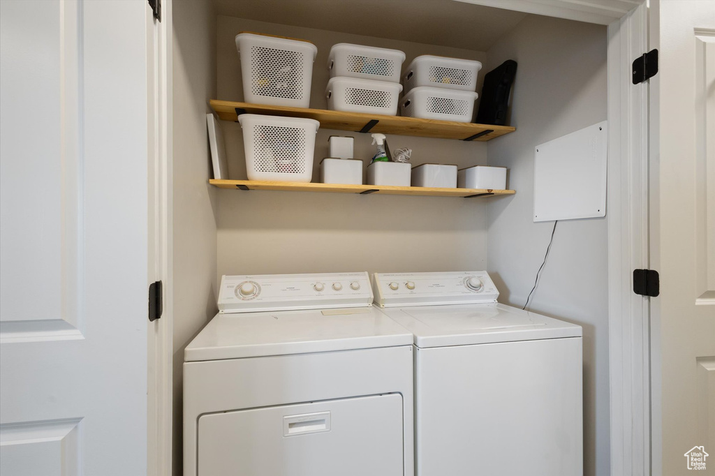 Laundry area with washing machine and clothes dryer