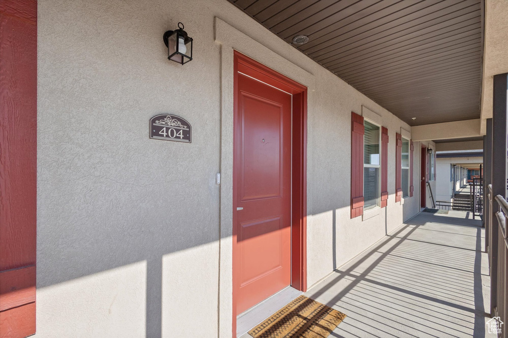 Doorway to property with stucco siding