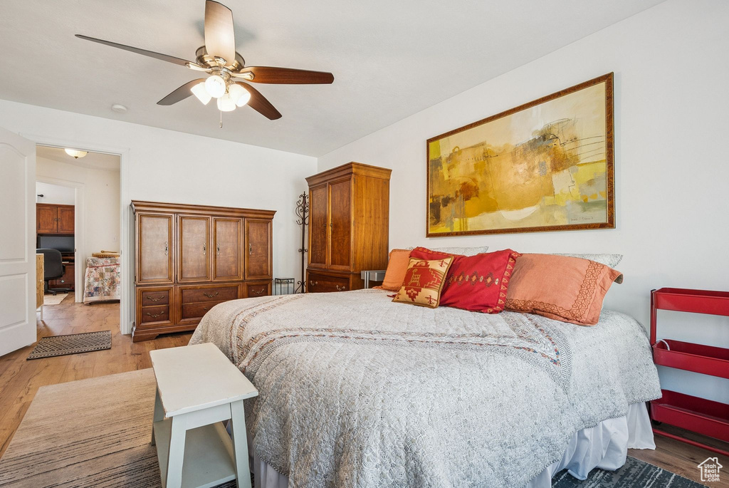 Bedroom featuring wood finished floors and a ceiling fan