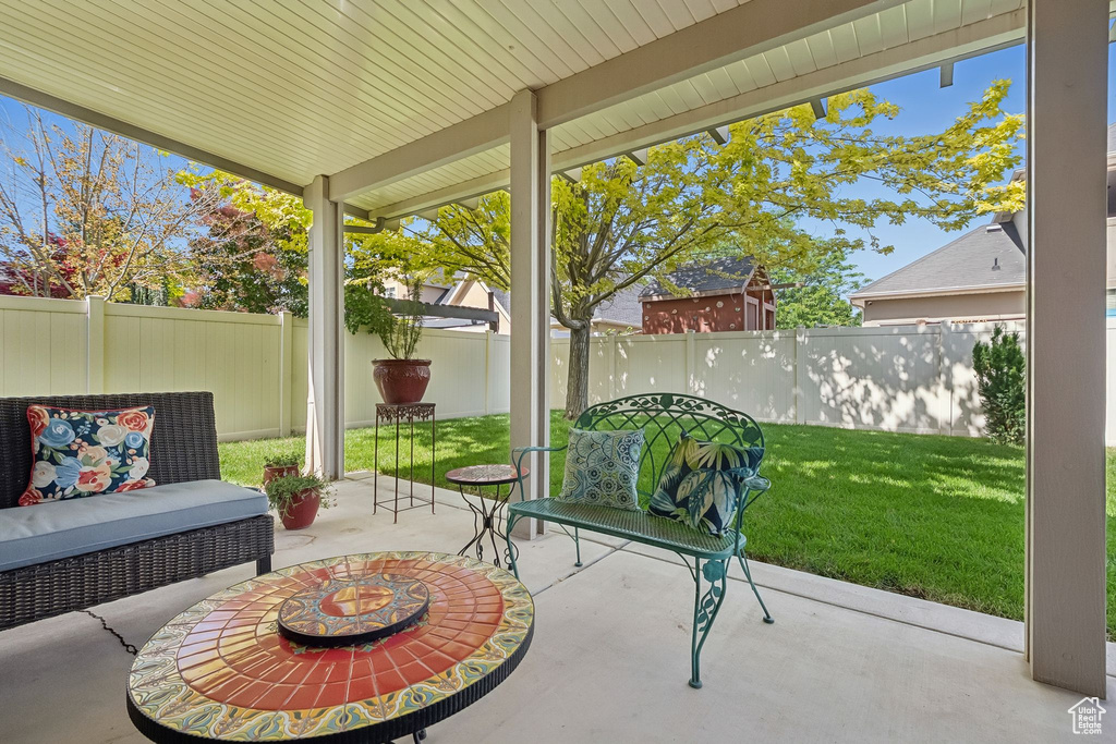 Fenced backyard with a patio area