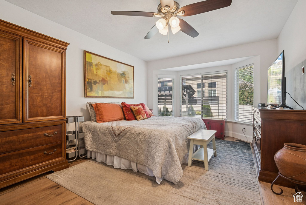 Bedroom featuring light wood-style flooring and ceiling fan