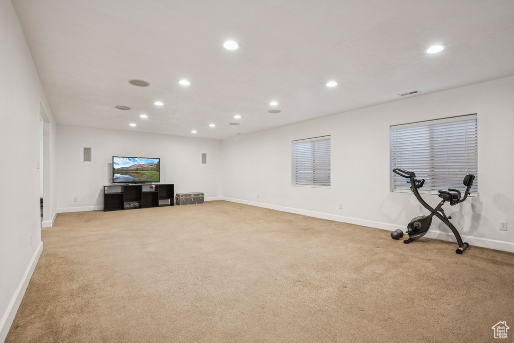 Workout area featuring recessed lighting and light colored carpet
