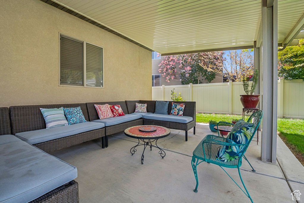 View of patio with an outdoor living space