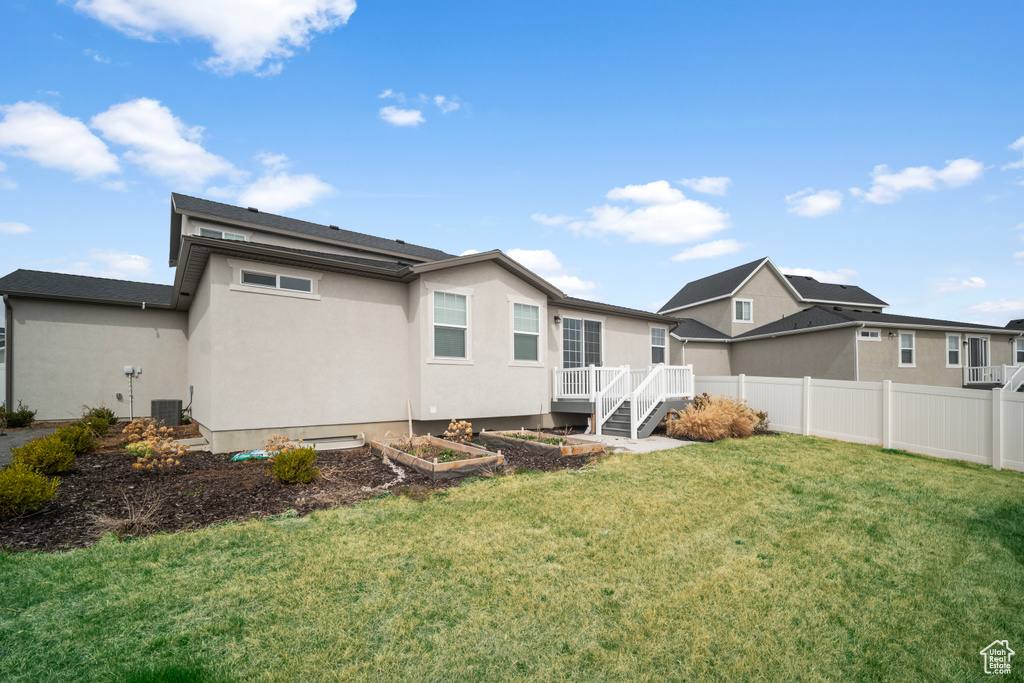 Back of property featuring stucco siding