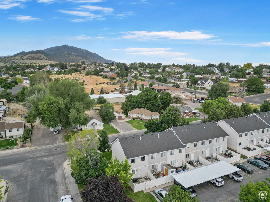 Aerial view of residential area featuring a mountain backdrop