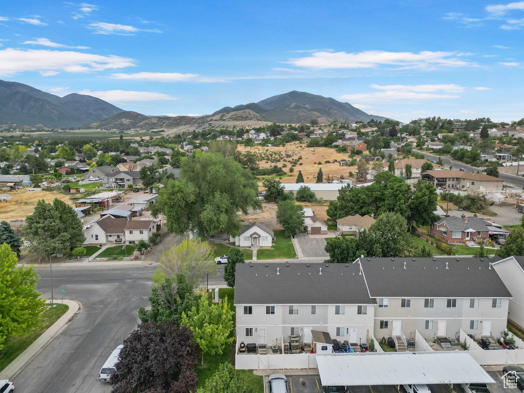 Aerial perspective of suburban area with a mountain backdrop