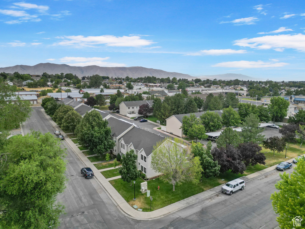 Aerial view of residential area featuring mountains