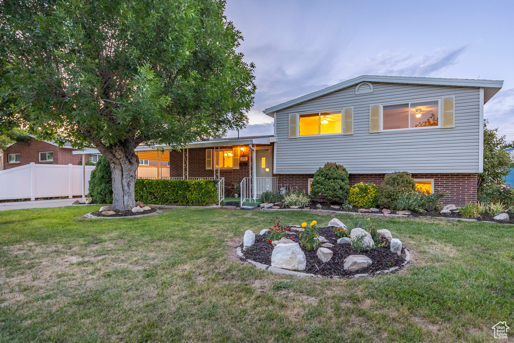 Split level home with brick siding