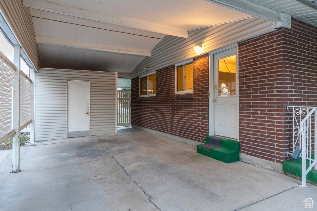 Doorway to property with brick siding