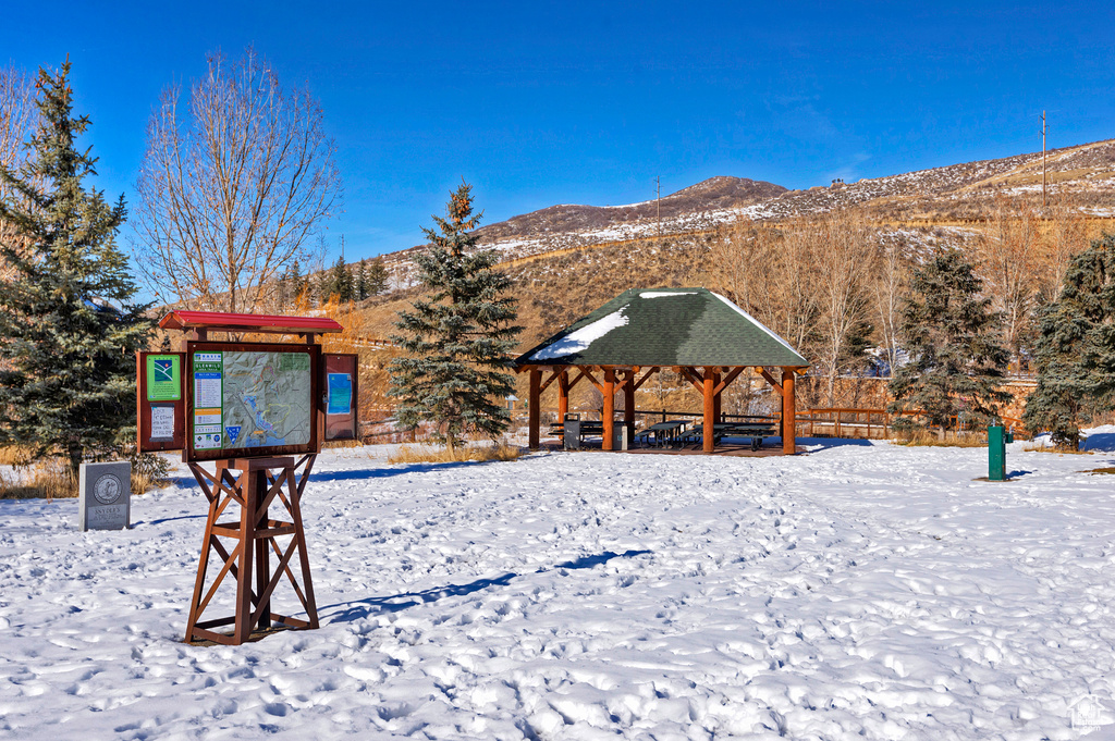 Surrounding community with a gazebo and a mountain view