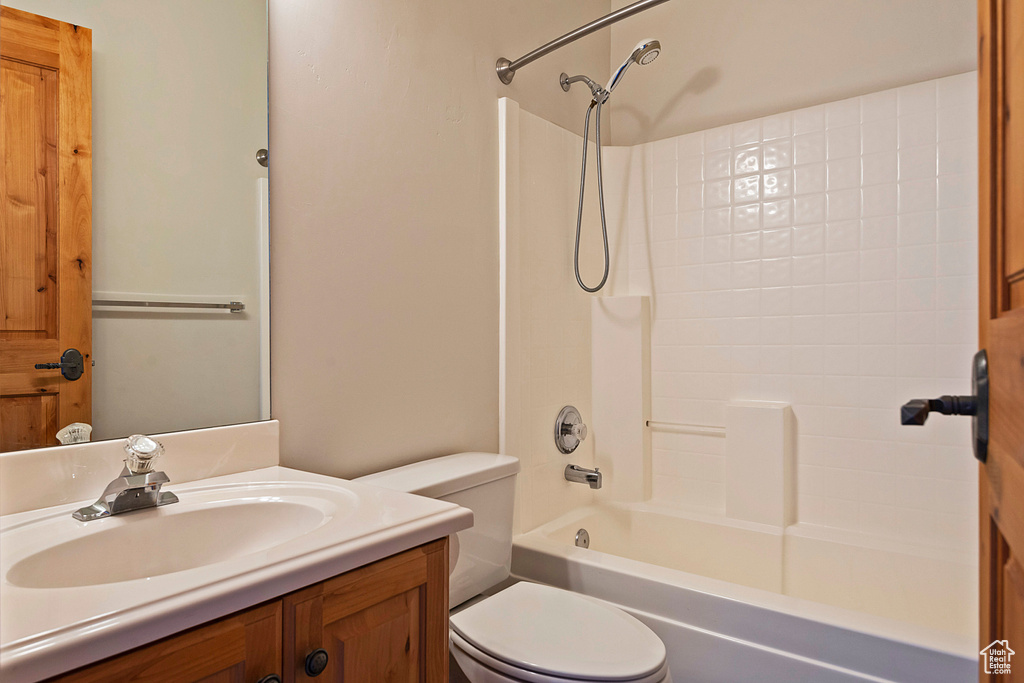 Bathroom with vanity and shower / bathtub combination