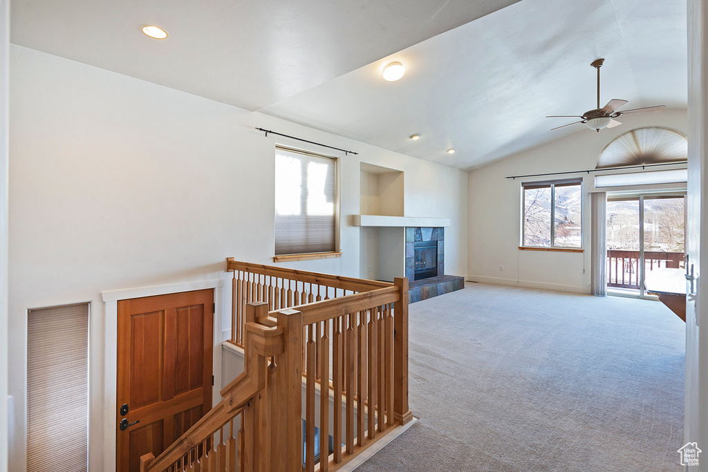 Hall featuring an upstairs landing, carpet, recessed lighting, and high vaulted ceiling