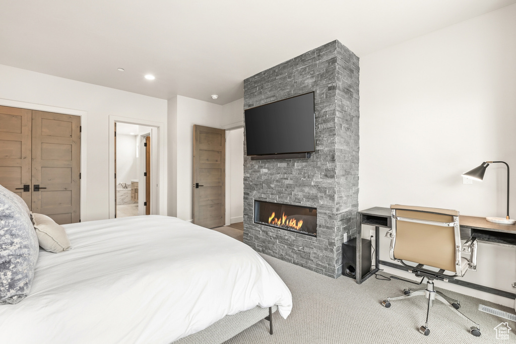 Bedroom with a fireplace, a desk, carpet flooring, and recessed lighting
