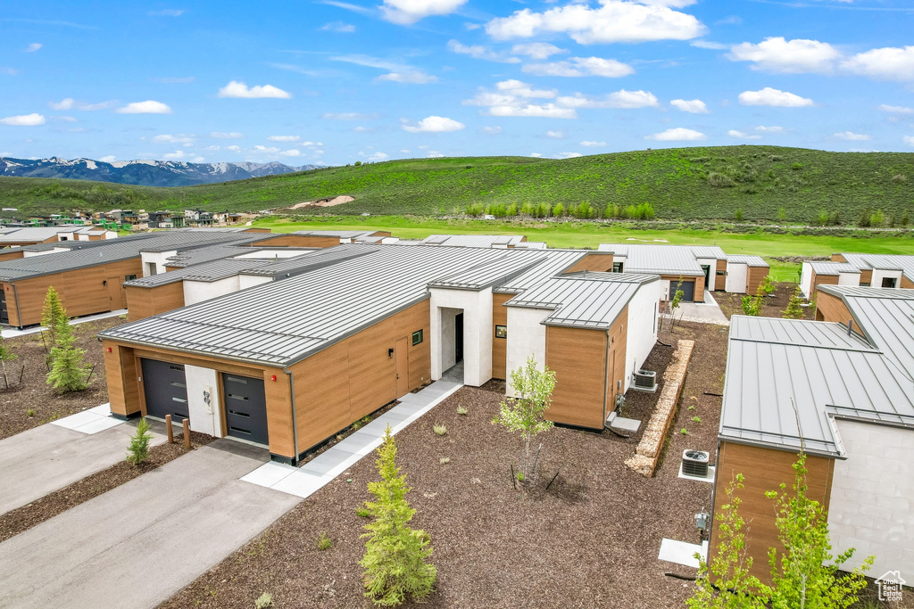 View of subject property with a mountain backdrop