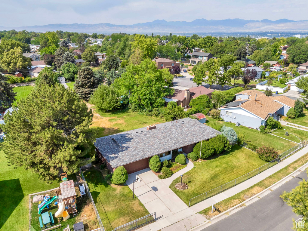 Aerial view of residential area with a mountainous background