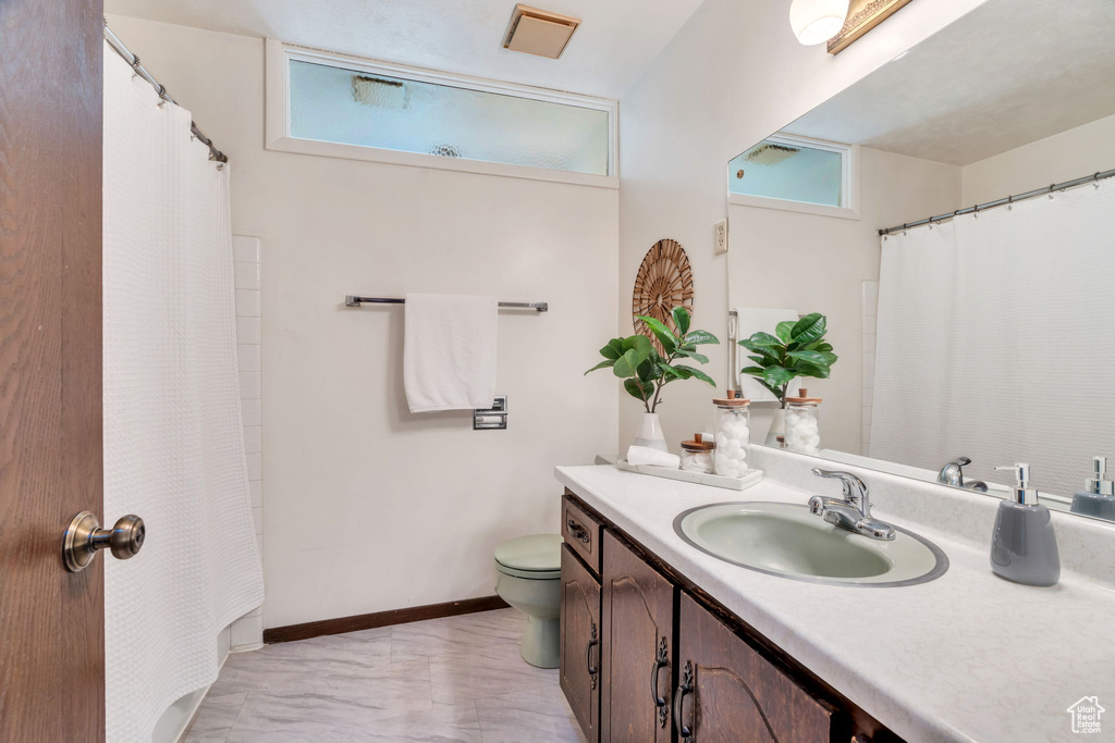 Bathroom with vanity and a shower with curtain
