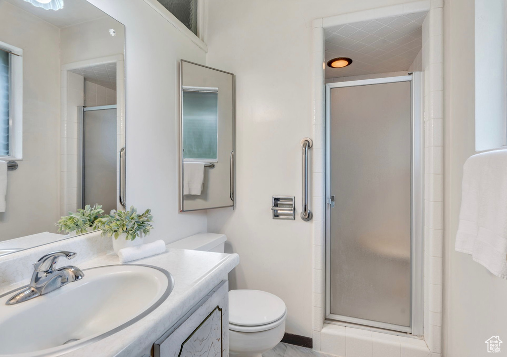 Full bath featuring vanity and a stall shower