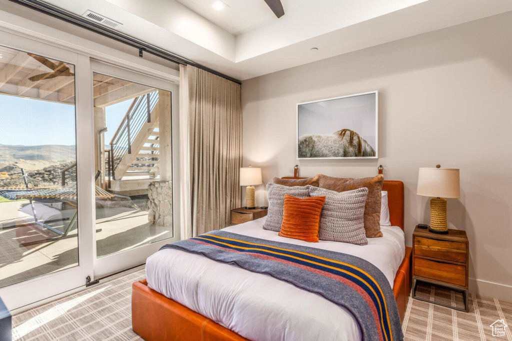 Bedroom with access to outside and ceiling fan