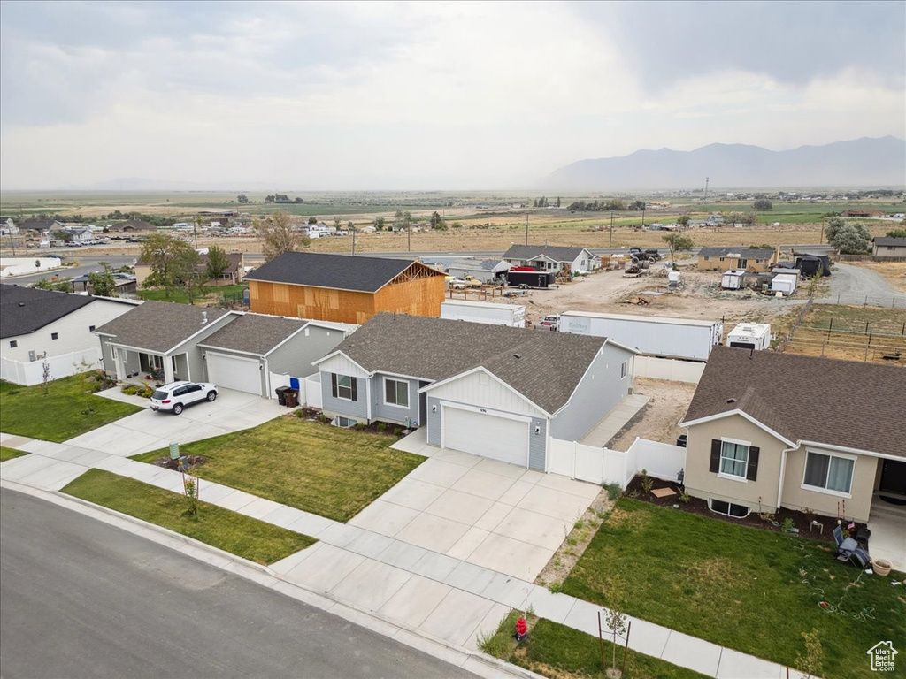 Aerial view of residential area with a mountainous background