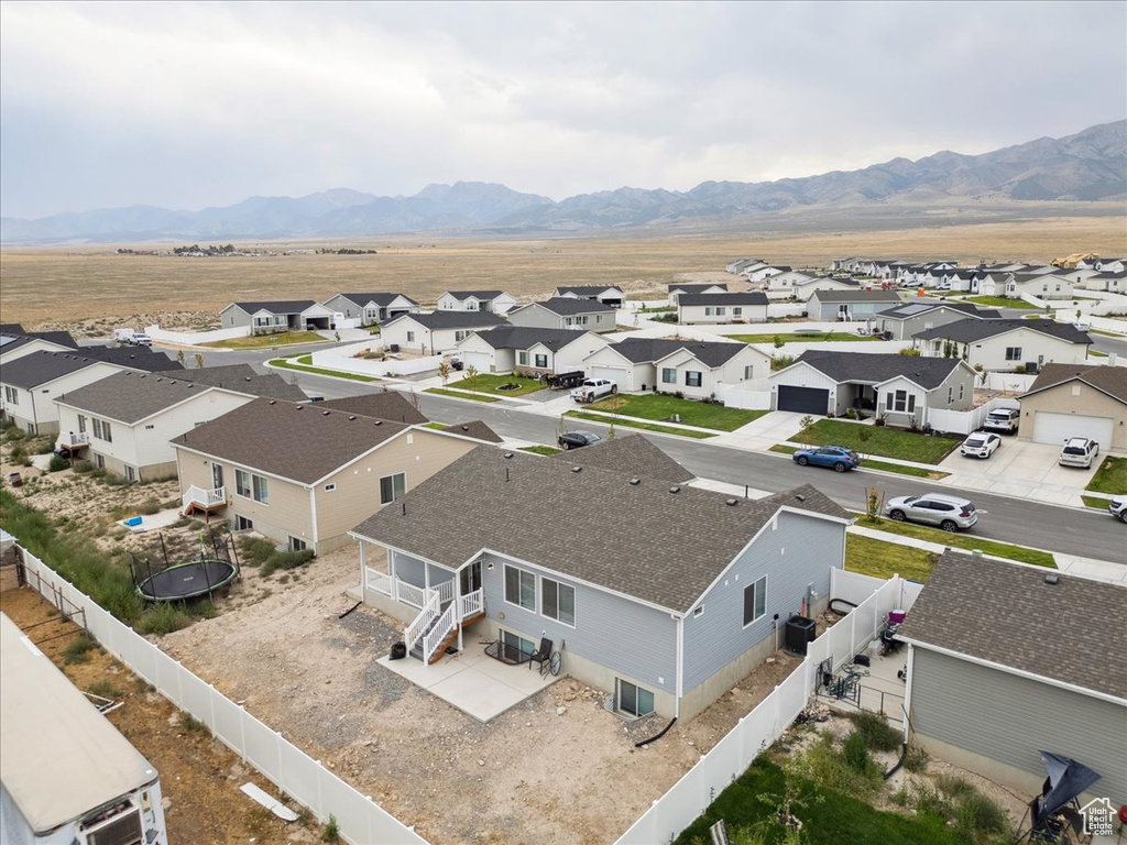 Aerial view of residential area with a mountainous background