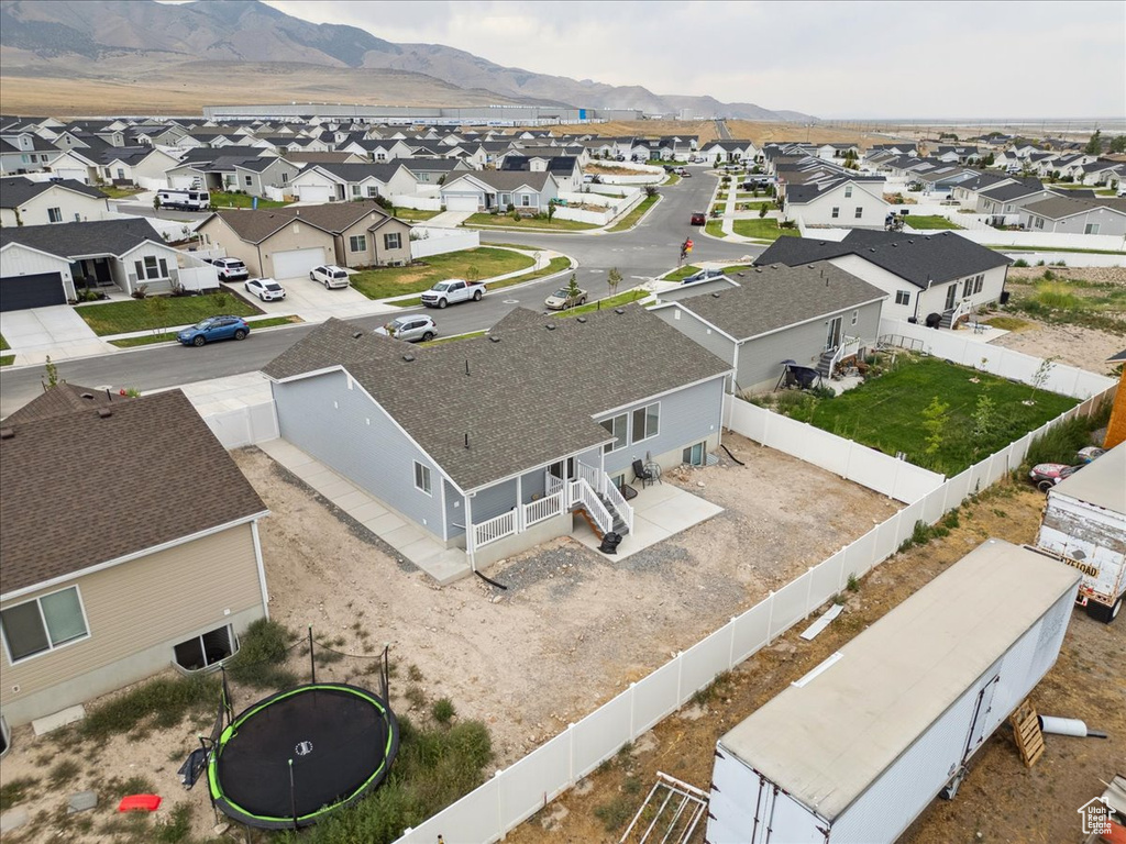 Aerial perspective of suburban area featuring a mountain backdrop