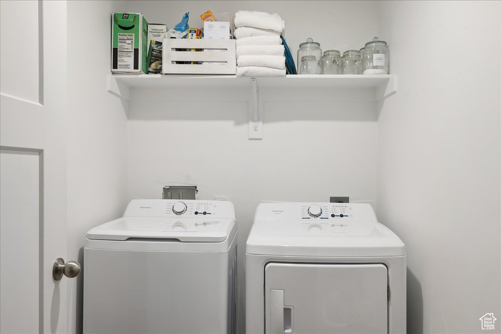 Laundry area with washer and clothes dryer