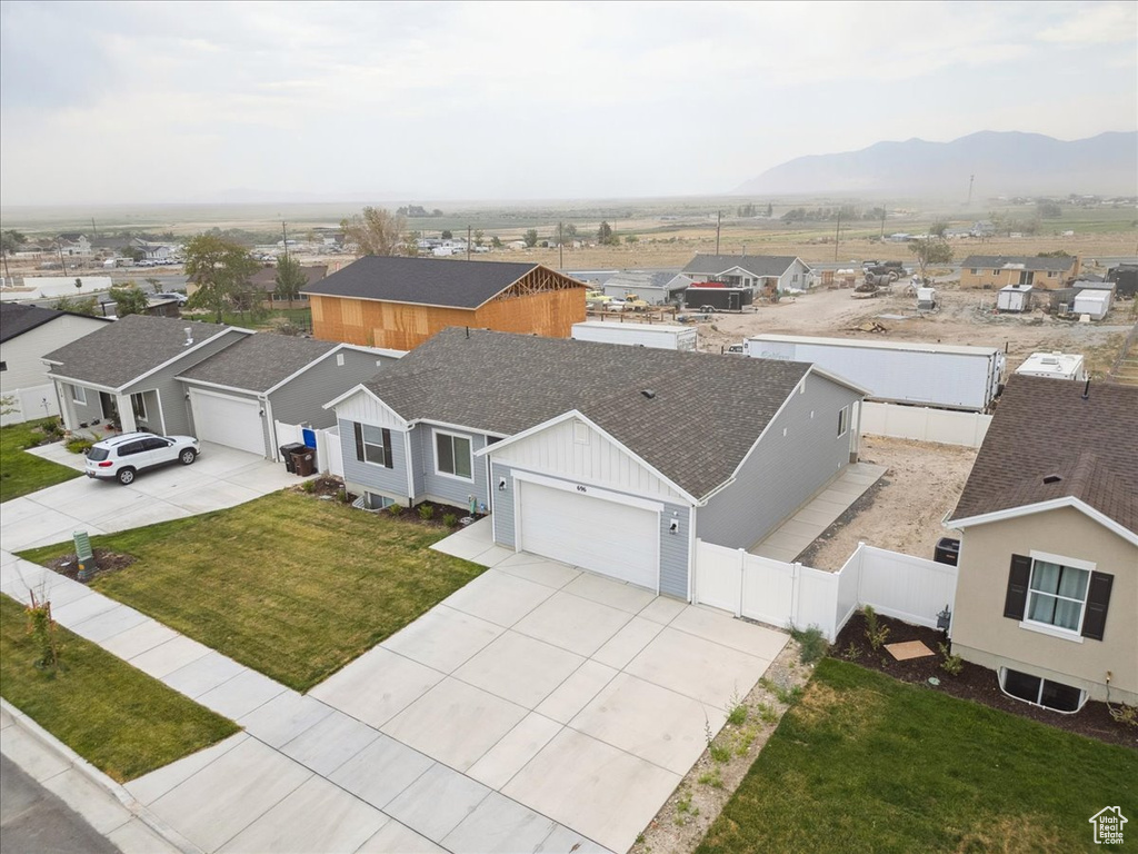 Aerial perspective of suburban area with a mountainous background