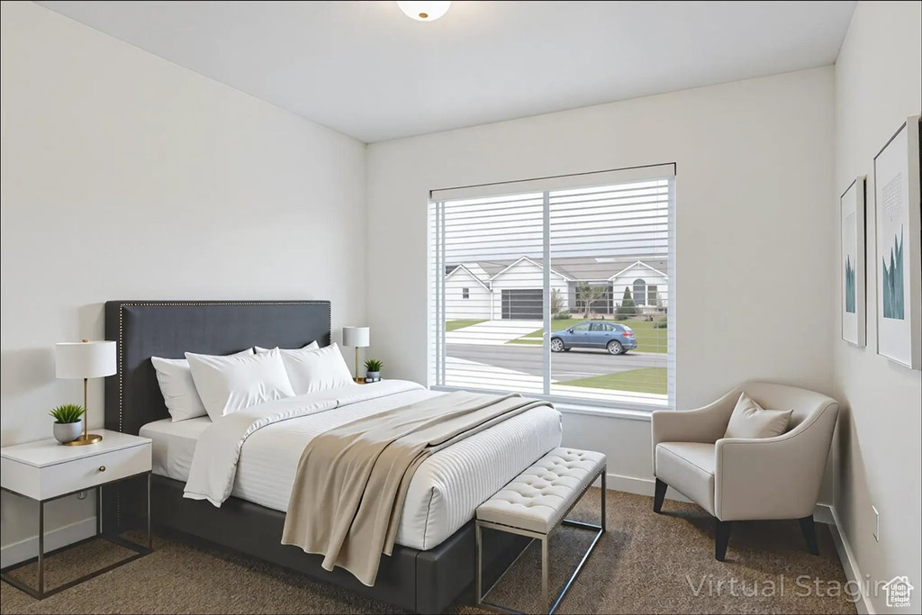 Carpeted bedroom with baseboards